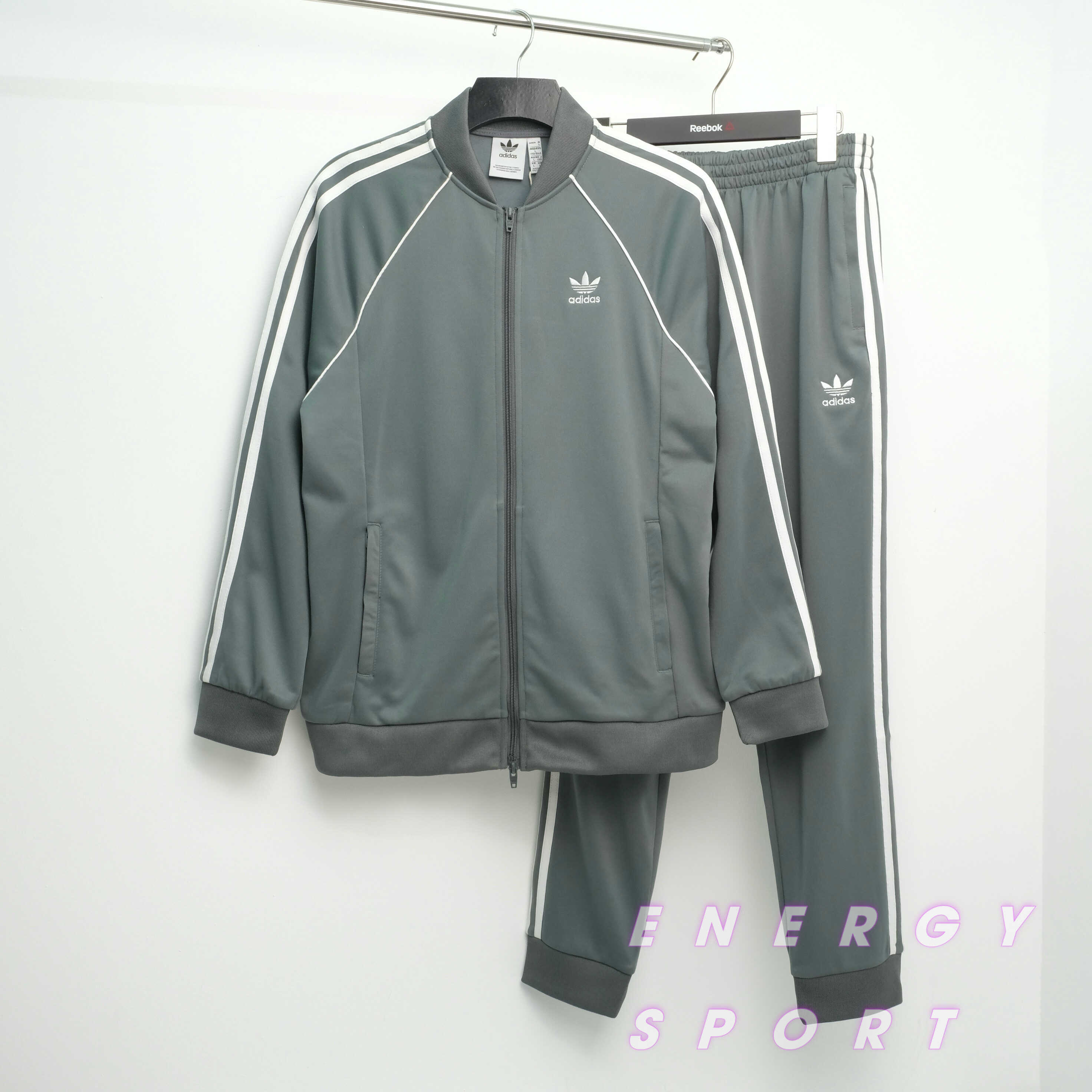 Bộ Quần Áo Thể Thao Unisex Nam Nữ Adidas Adicolor Classic Primeblue SST Track - Màu Xi Măng
