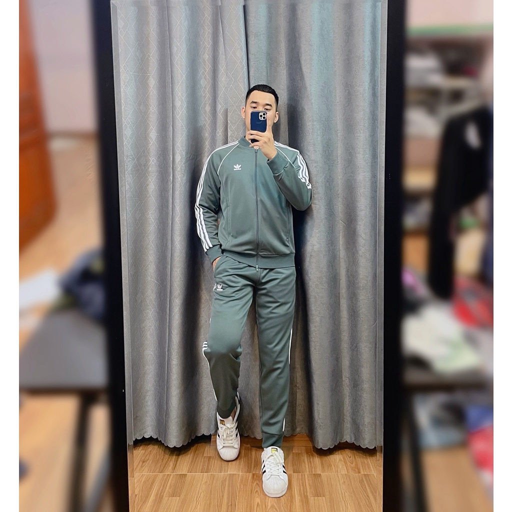 Bộ Quần Áo Thể Thao Unisex Nam Nữ Adidas Adicolor Classic Primeblue SST Track - Màu Xi Măng