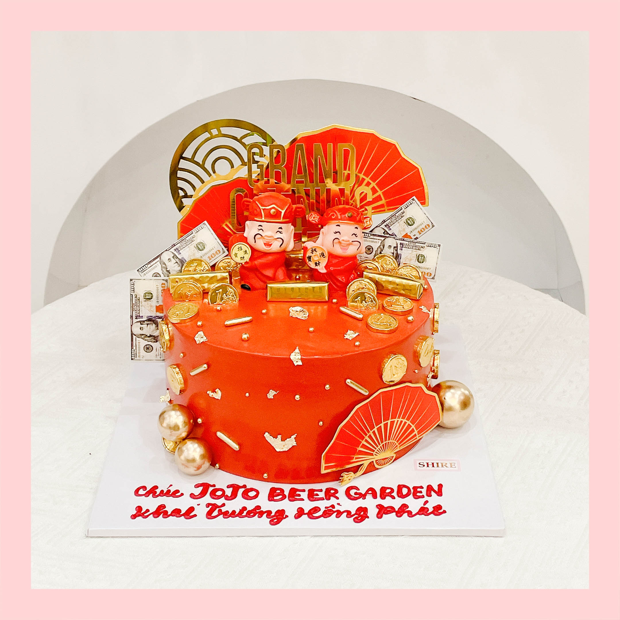 Bánh kem khai trương hình hũ vàng, túi vàng