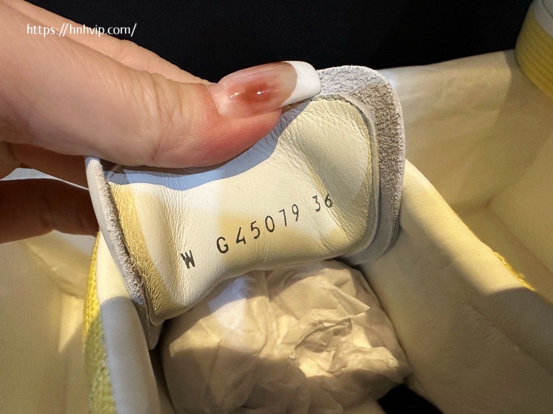 Chanel white and yellow sneakers