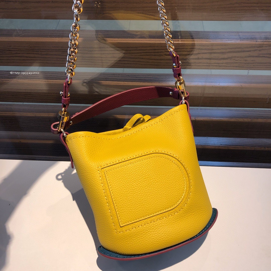 Delvaux Pin Mini Bucket Surpiquéen Taurillon Soft AA0607ATT0ADNDO yellow