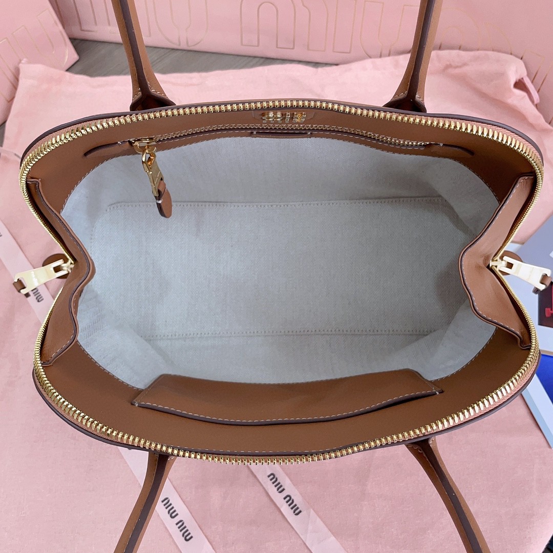 Miu Miu 5BA290_2CRM_F0046_V_OOO leather bag cognac M1
