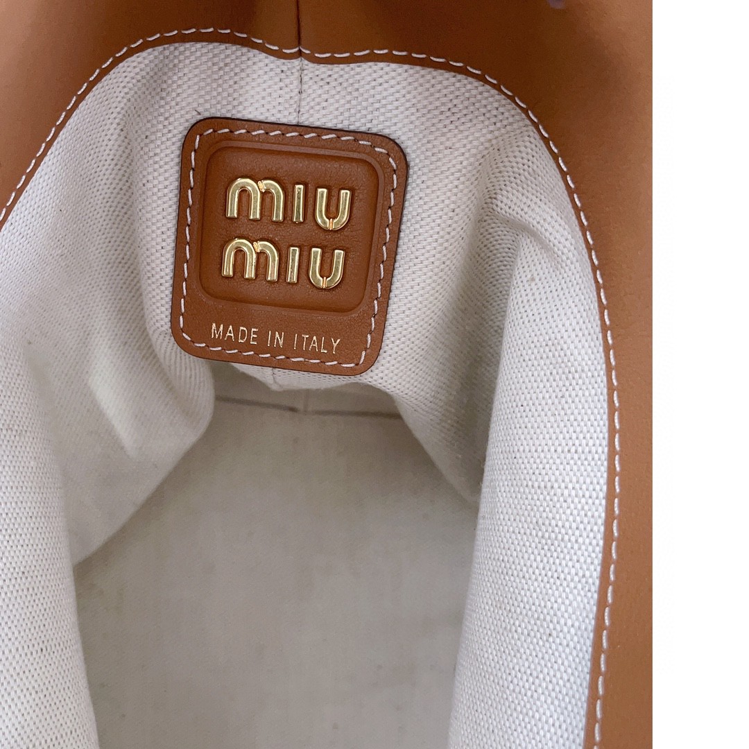 Miu Miu leather bucket bag cognac 5BE090_2CRM_F0046_V_OOO M1