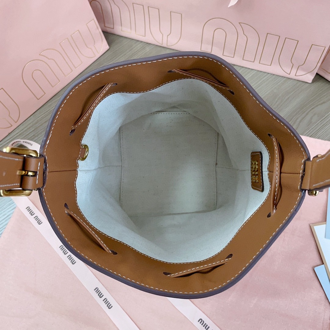 Miu Miu leather bucket bag cognac 5BE090_2CRM_F0046_V_OOO M1