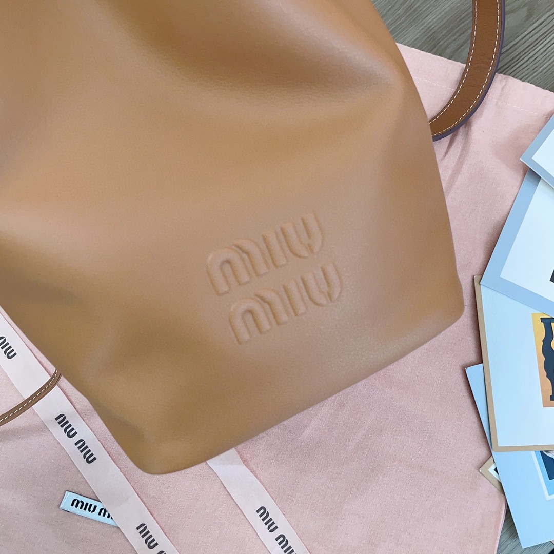 Miu Miu leather bucket bag cognac 5BE090_2CRM_F0046_V_OOO M1