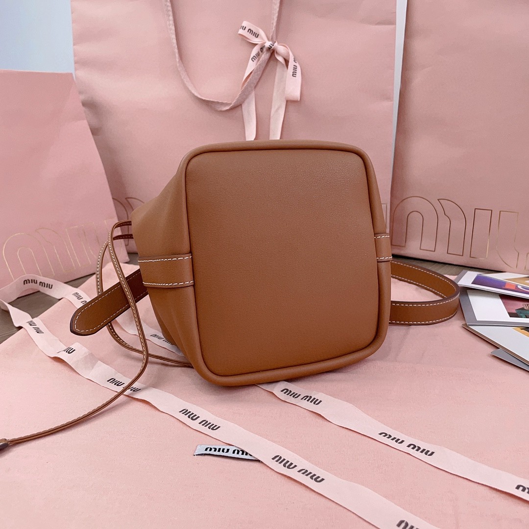 Miu Miu leather bucket bag cognac 5BE090_2CRM_F0046_V_OOO M1
