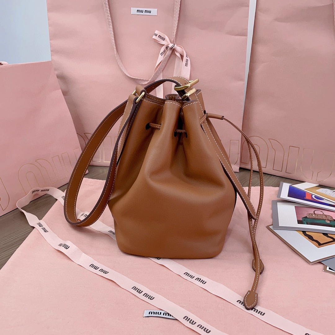 Miu Miu leather bucket bag cognac 5BE090_2CRM_F0046_V_OOO M1