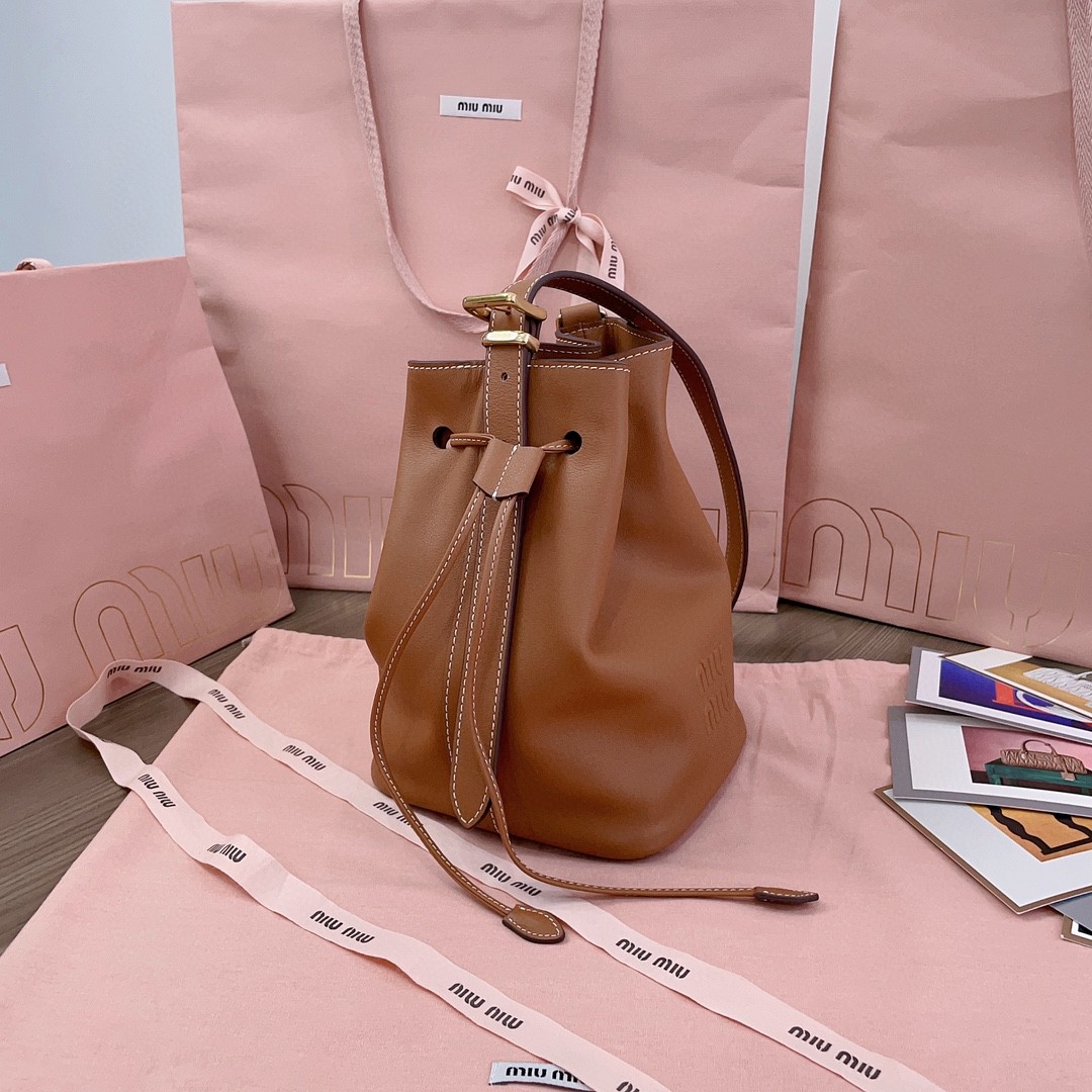 Miu Miu leather bucket bag cognac 5BE090_2CRM_F0046_V_OOO M1
