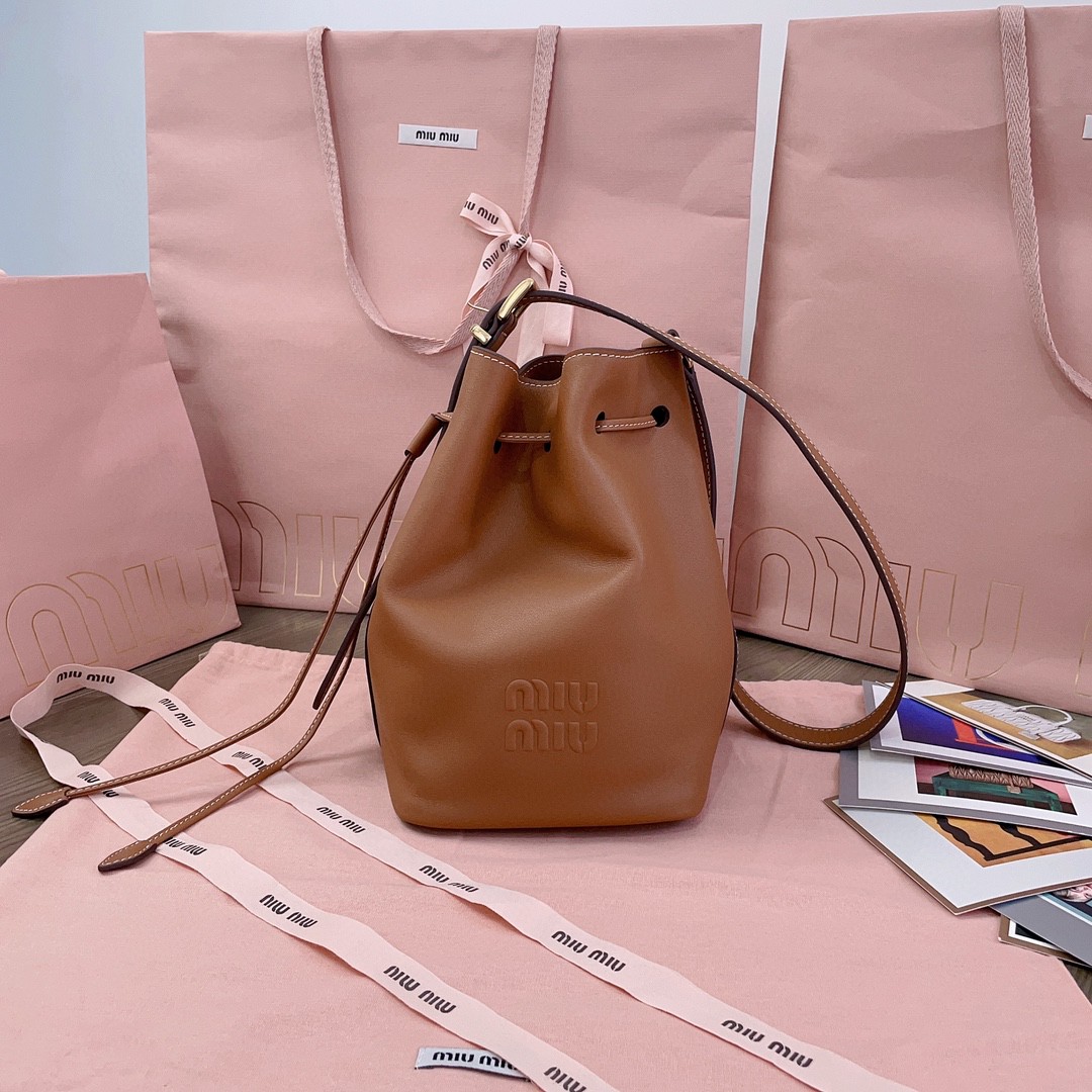 Miu Miu leather bucket bag cognac 5BE090_2CRM_F0046_V_OOO M1
