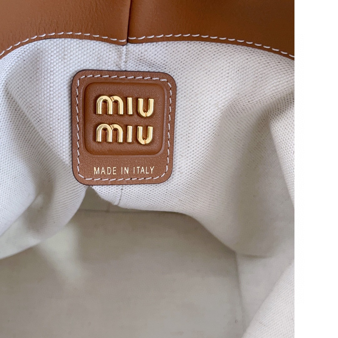 Miu Miu leather bucket bag cognac 5BE089_2CRM_F0046_V_OOO M1