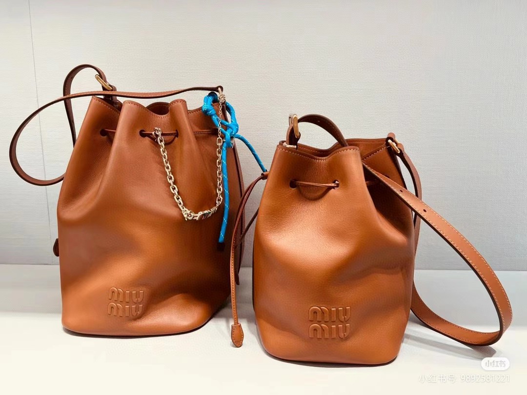 Miu Miu leather bucket bag cognac 5BE089_2CRM_F0046_V_OOO M1