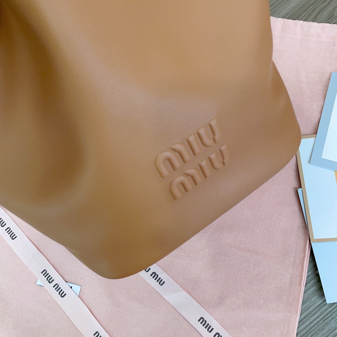 Miu Miu leather bucket bag cognac 5BE089_2CRM_F0046_V_OOO M1