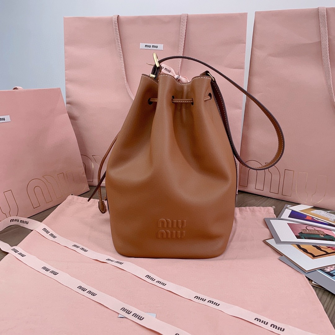 Miu Miu leather bucket bag cognac 5BE089_2CRM_F0046_V_OOO M1
