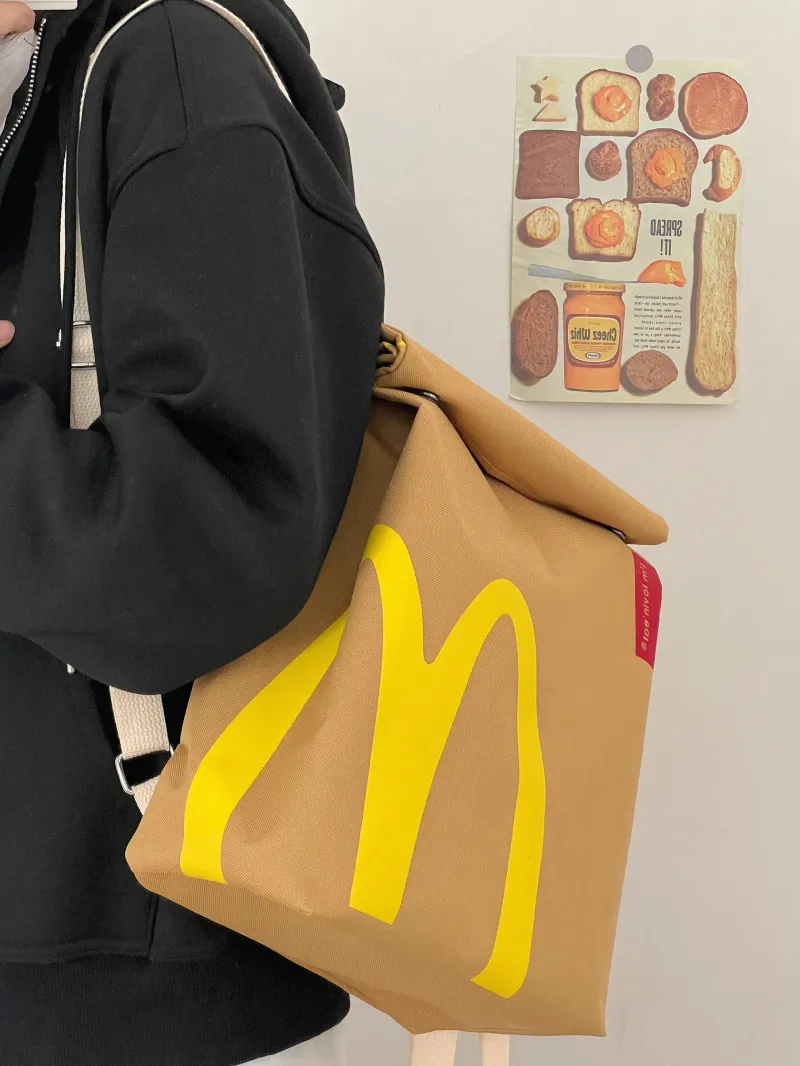 Balo túi xách, túi đeo Mcdonalds chữ M cho bé đi học, đi phượt phong cách Hàn Quốc