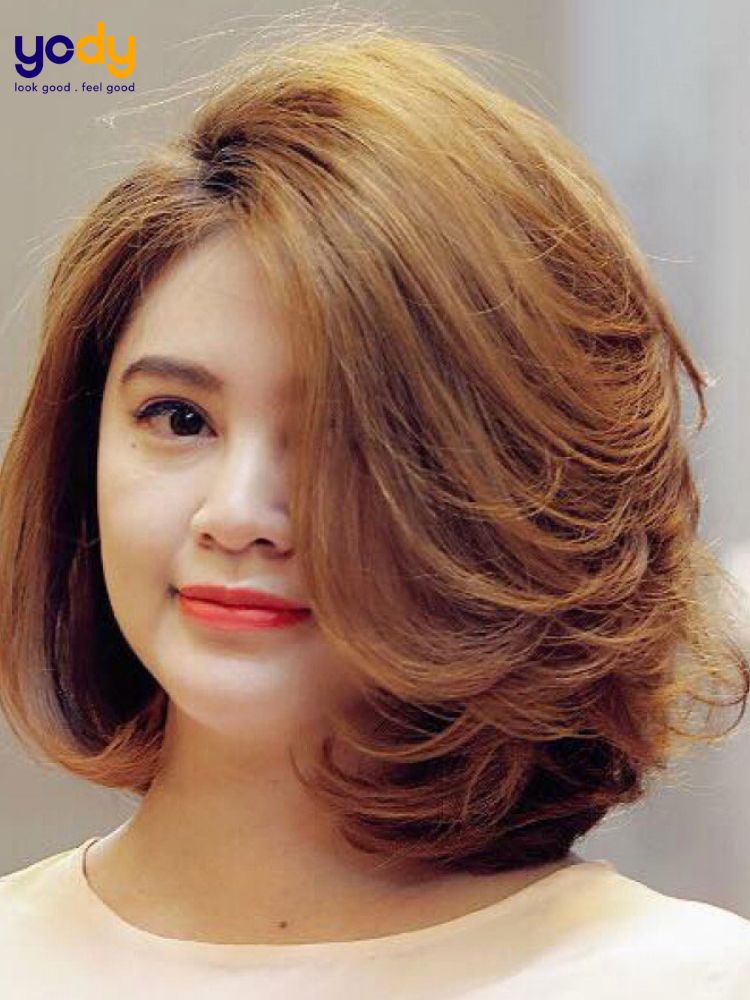 Kiểu tóc đi tiệc cho mặt tròn nữ uốn cúp