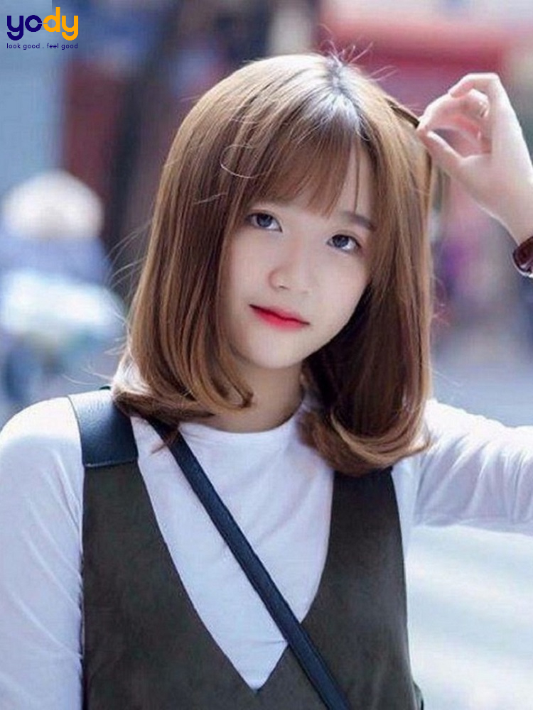 tóc xoăn ngang vai cho mặt tròn
