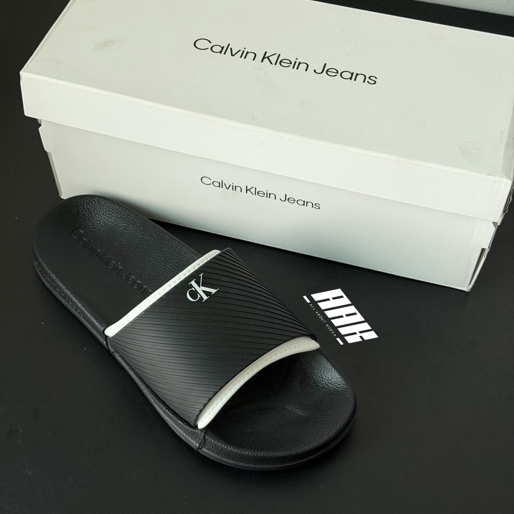Calvin Klein Slide Rubber Neoprene Text / Black ( YM01234-0GM )