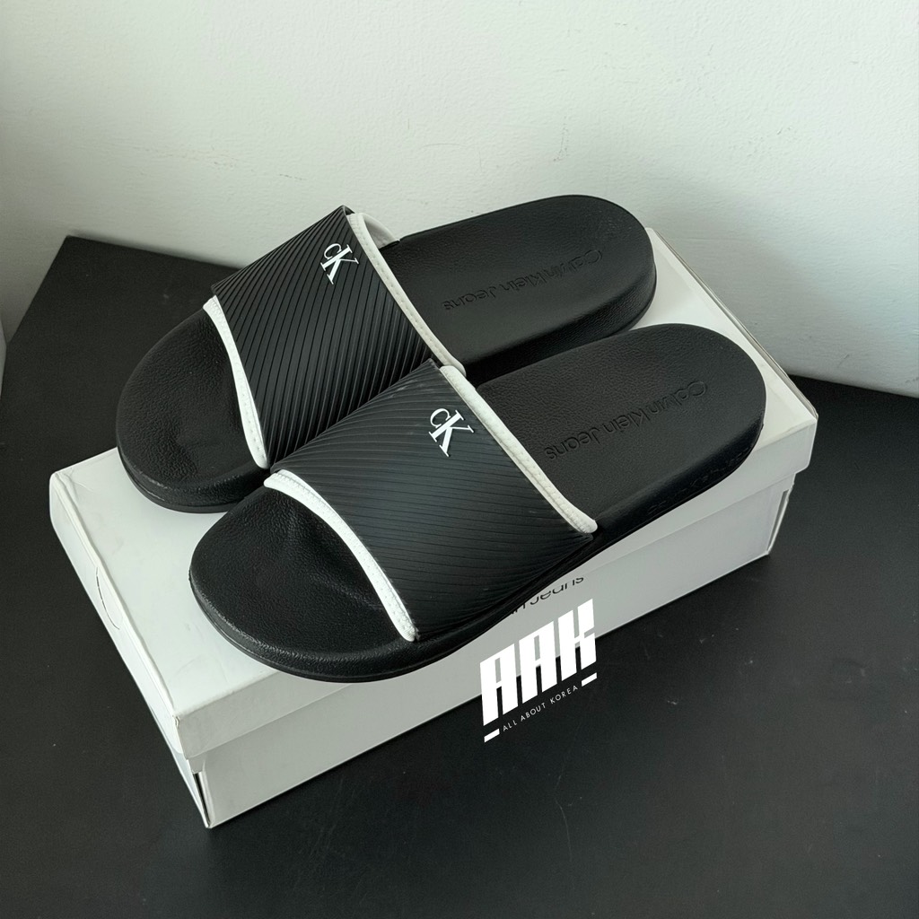 Calvin Klein Slide Rubber Neoprene Text / Black ( YM01234-0GM )