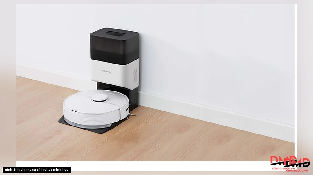 Roborock Q7 TF Plus robot vacuum cleaner docked in its auto-empty station against a white wall on a wooden floor