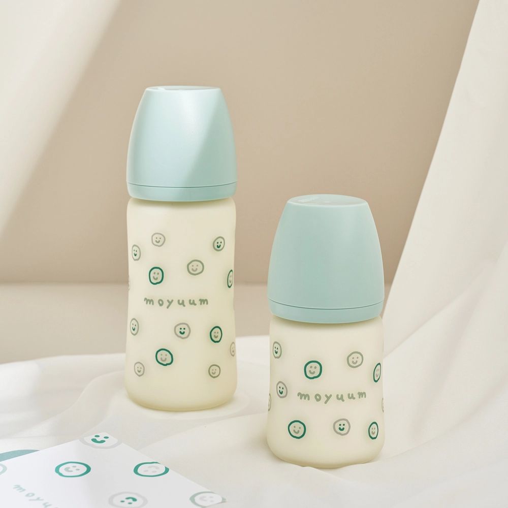 Bình sữa Moyuum thủy tinh tráng silicon hình mặt cười