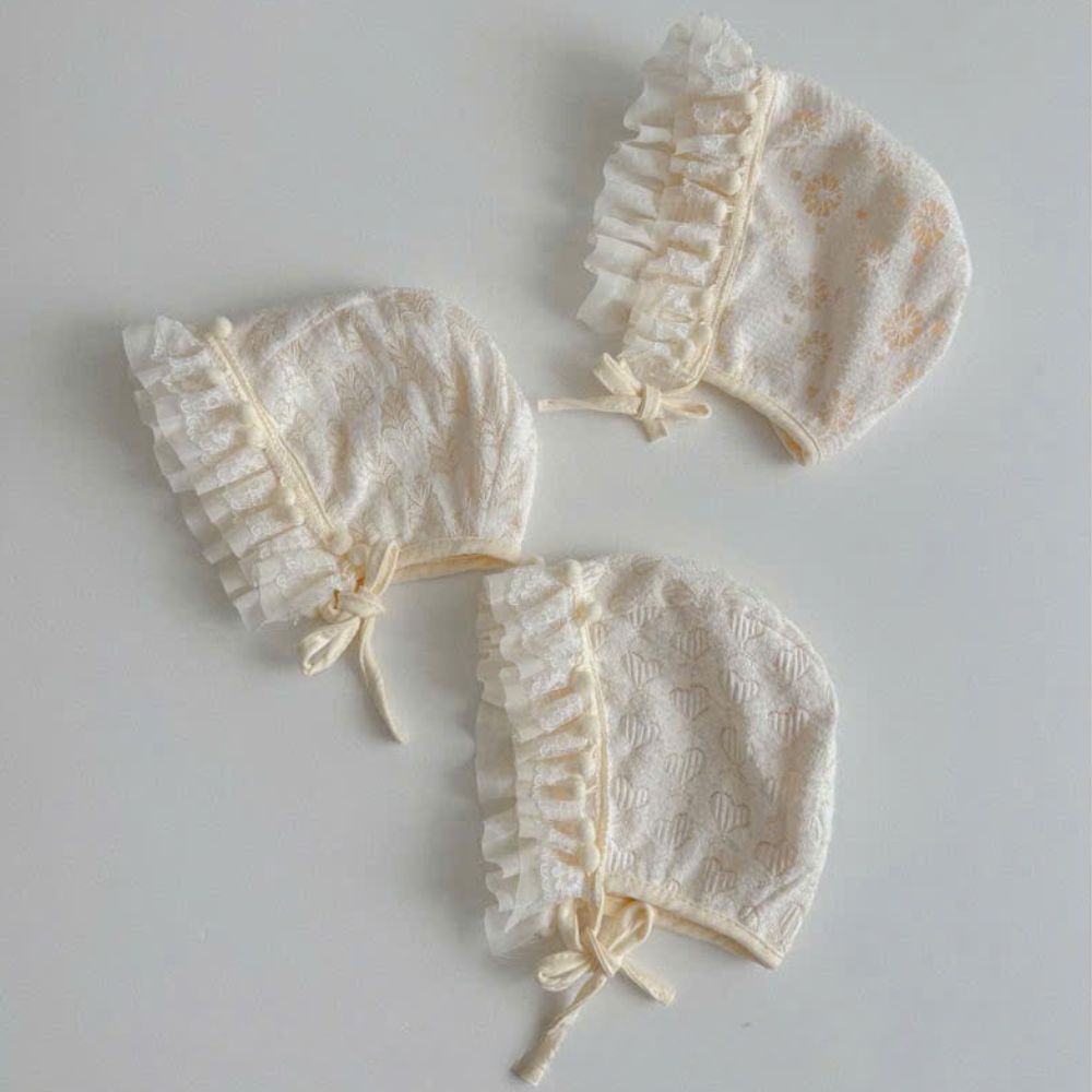 Mũ nón cột dây viền ren bèo hạt bông màu kem cho bé