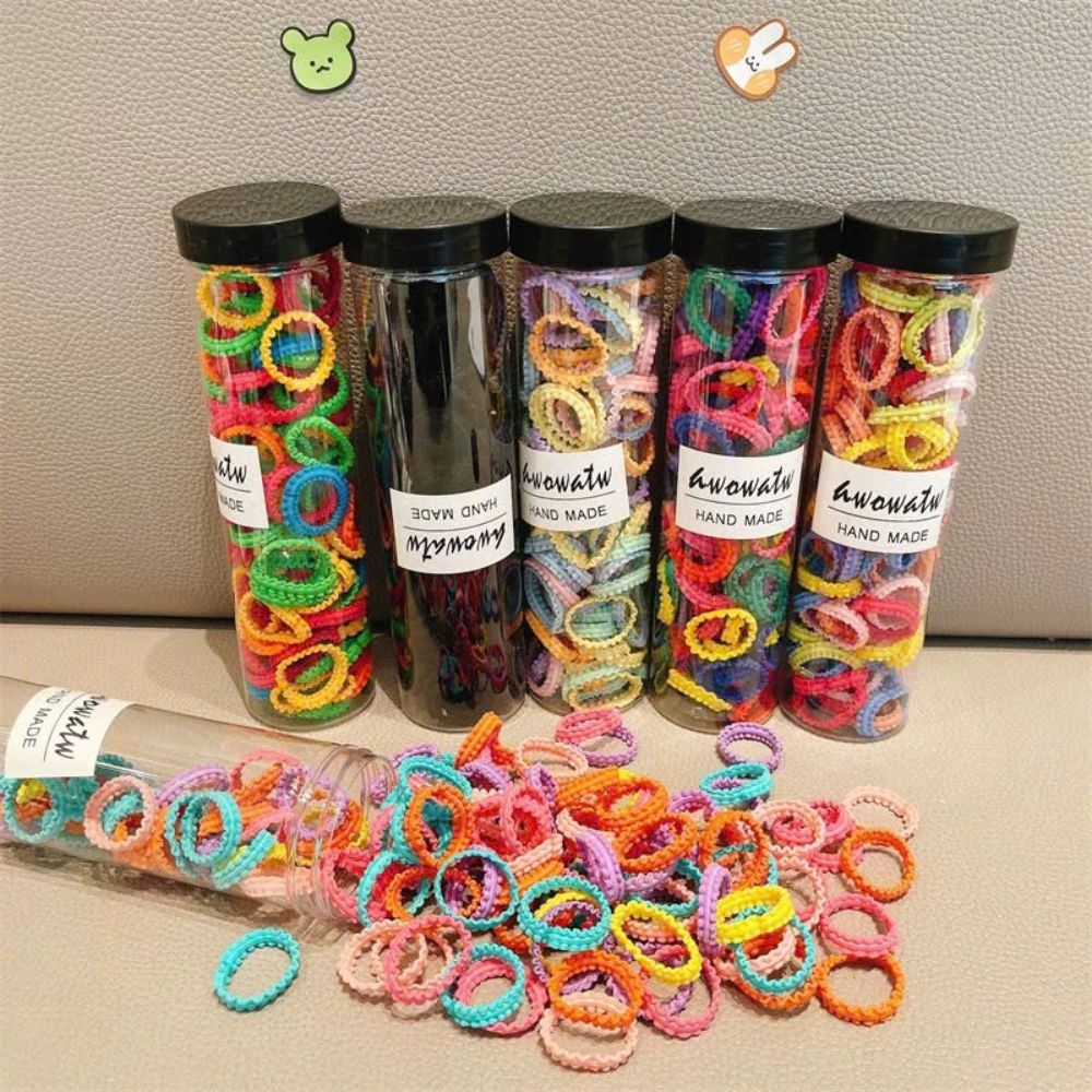 Hộp trụ đựng chun cột tóc nhiều màu cho bé