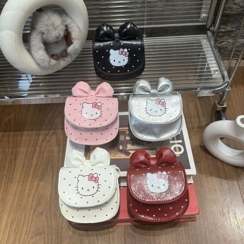 Túi xách Hello Kitty nắp nơ đeo chéo cho bé gái