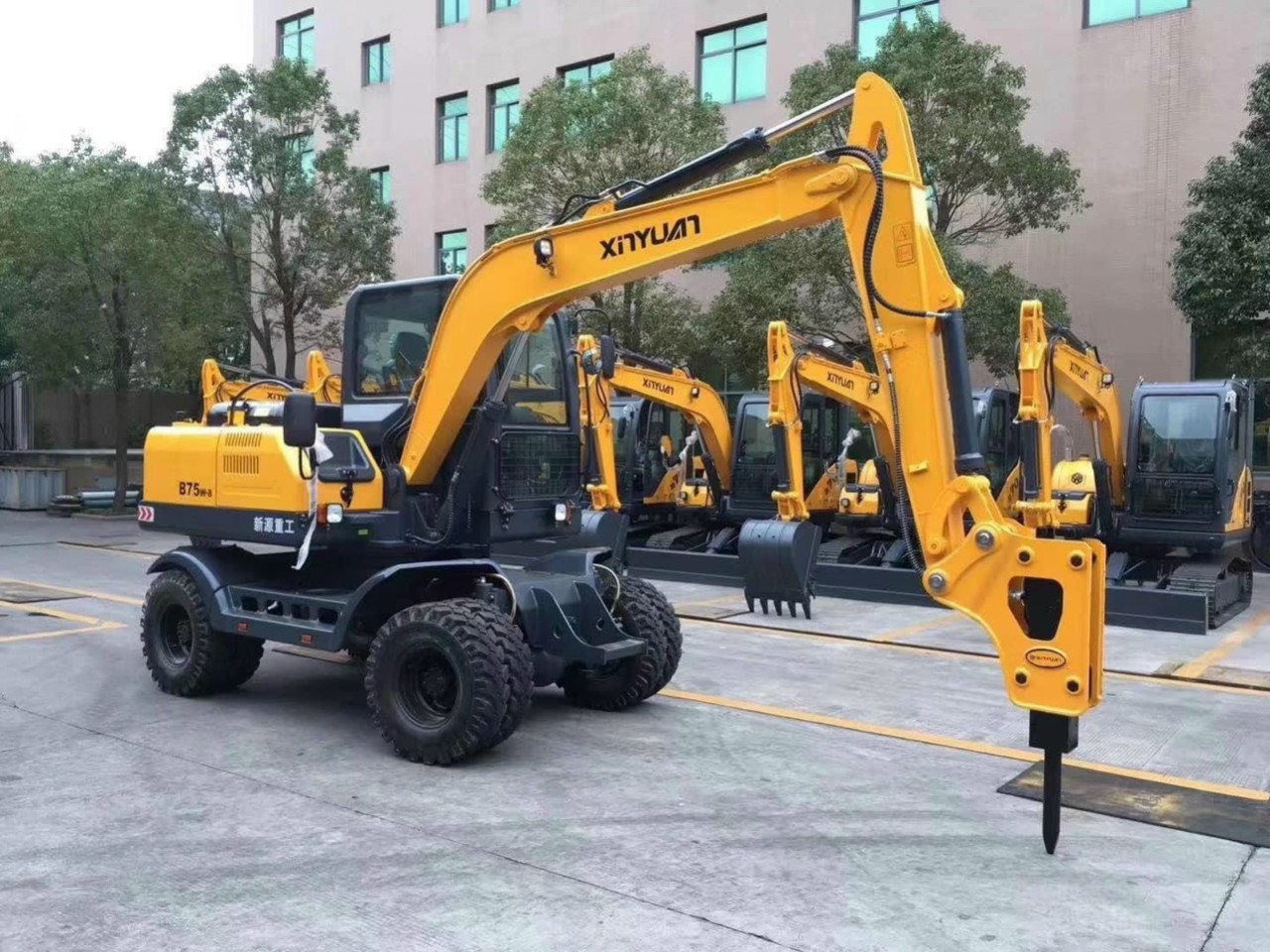 Máy xúc đào bánh lốp 55 Hải Âu Xinyuan gầu 0.3m3