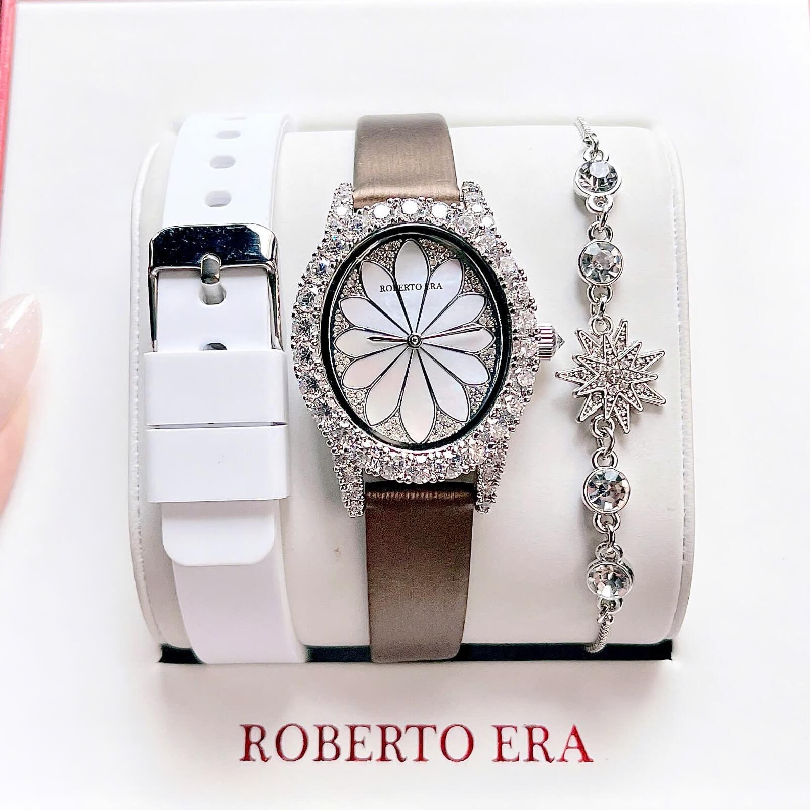 Set Đồng Hồ Nữ Roberto Era Dây Da Lụa Nâu Mặt Oval Họa Tiết 12 Cánh Hoa Size 33mm Viền Đá RE220 Tặng Kèm Bộ Dây Cao Su Trắng Và Vòng Tay