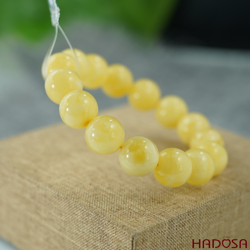 Vòng Hổ Phách Baltic vàng bơ 14mm