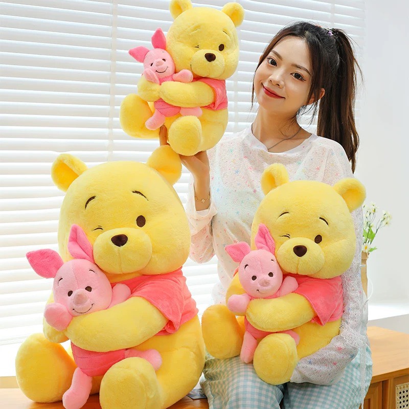 Gấu Pooh ôm heo Piglet