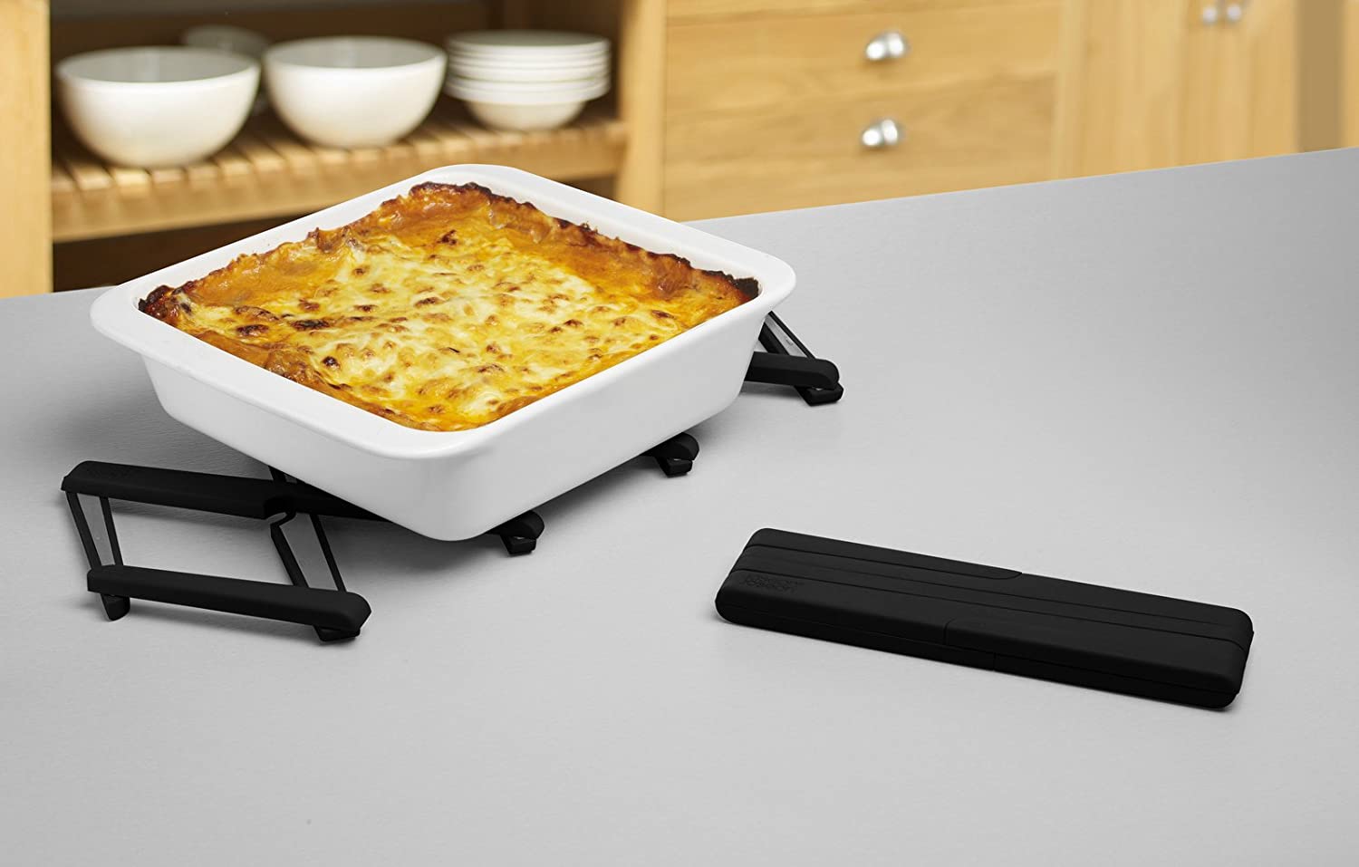 Giá lót nồi có thể điều chỉnh thu gọn, mở rộng thông minh Joseph Joseph 70033 Stretch™ - Ausziehbarer hitzebeständiger Untersetzer - Schwarz VE 4