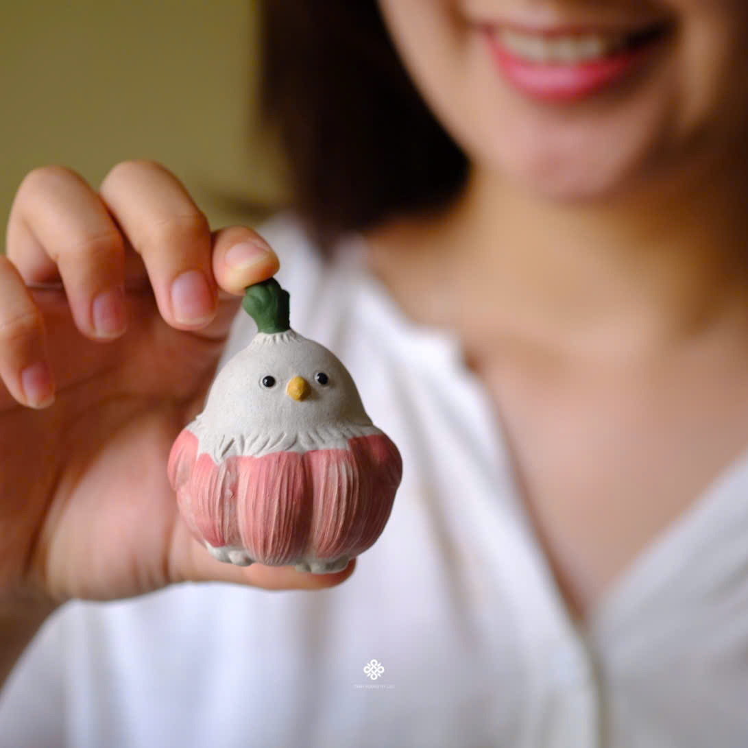Tượng gốm bé chim củ tỏi