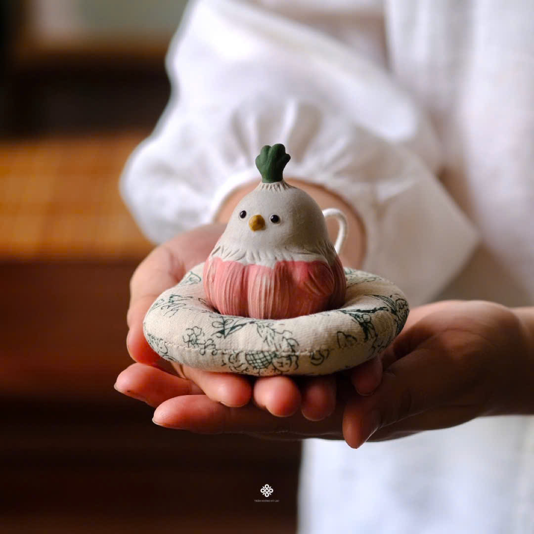 Tượng gốm bé chim củ tỏi