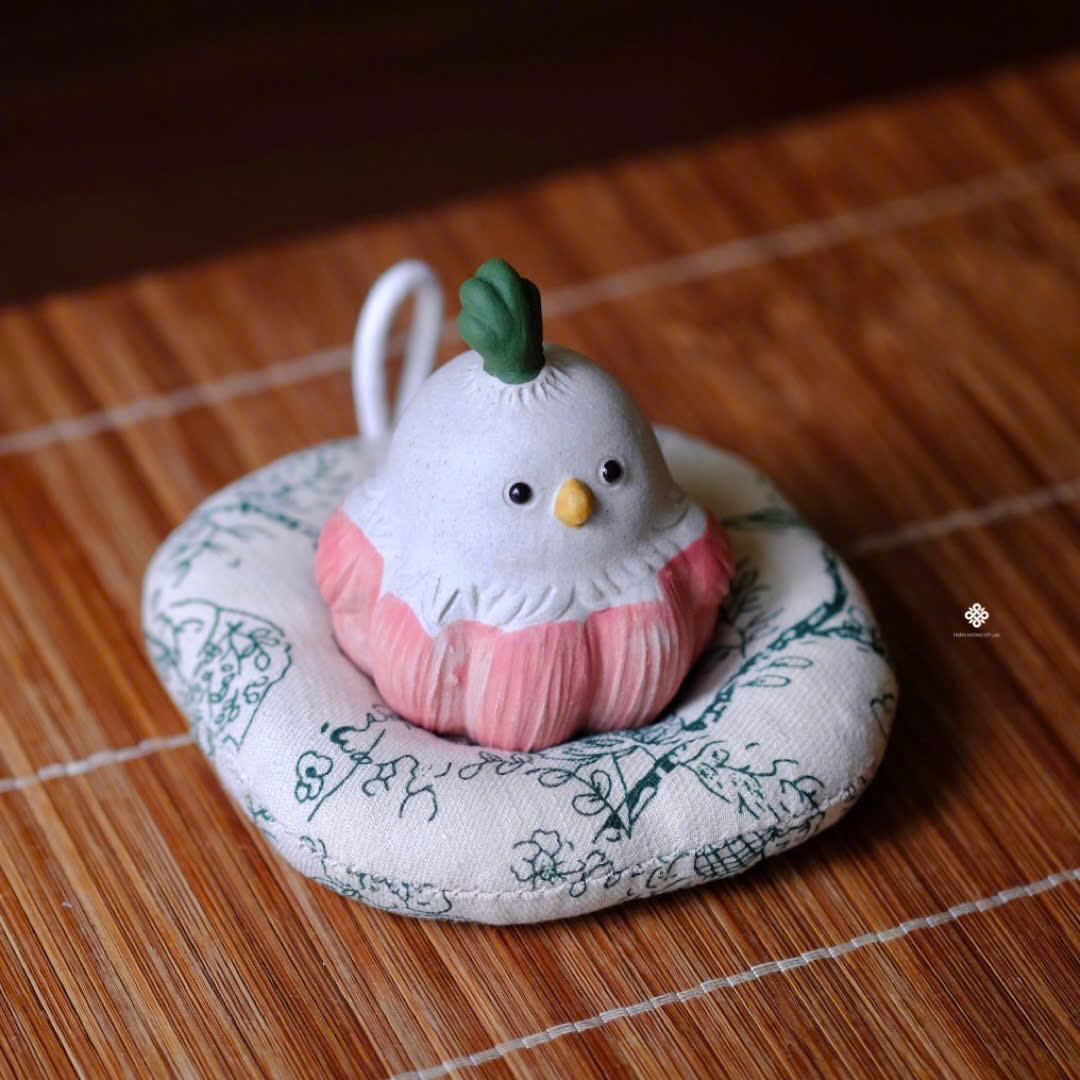 Tượng gốm bé chim củ tỏi