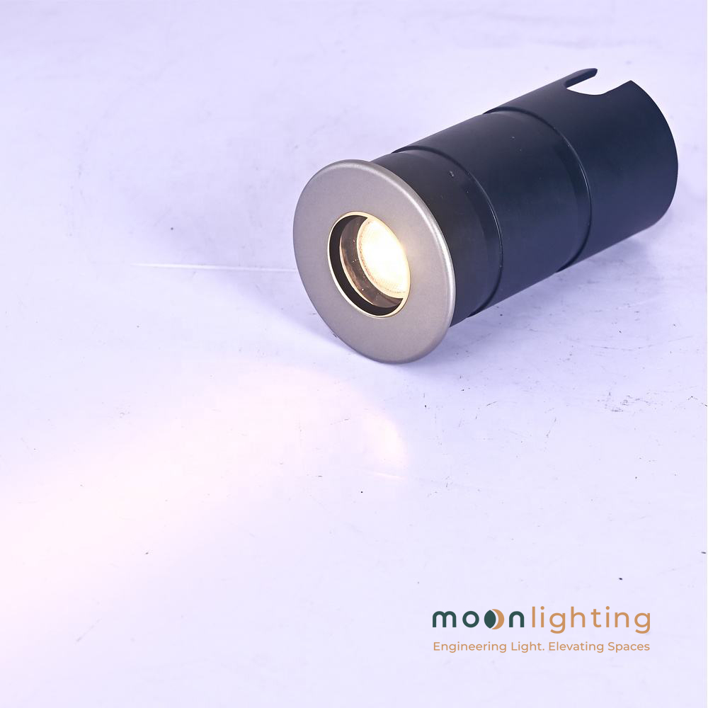 Hình ảnh thực tế đèn LED âm đất siêu nhỏ MG-316 Series Moon Lighting bật sáng trên đế ống âm
