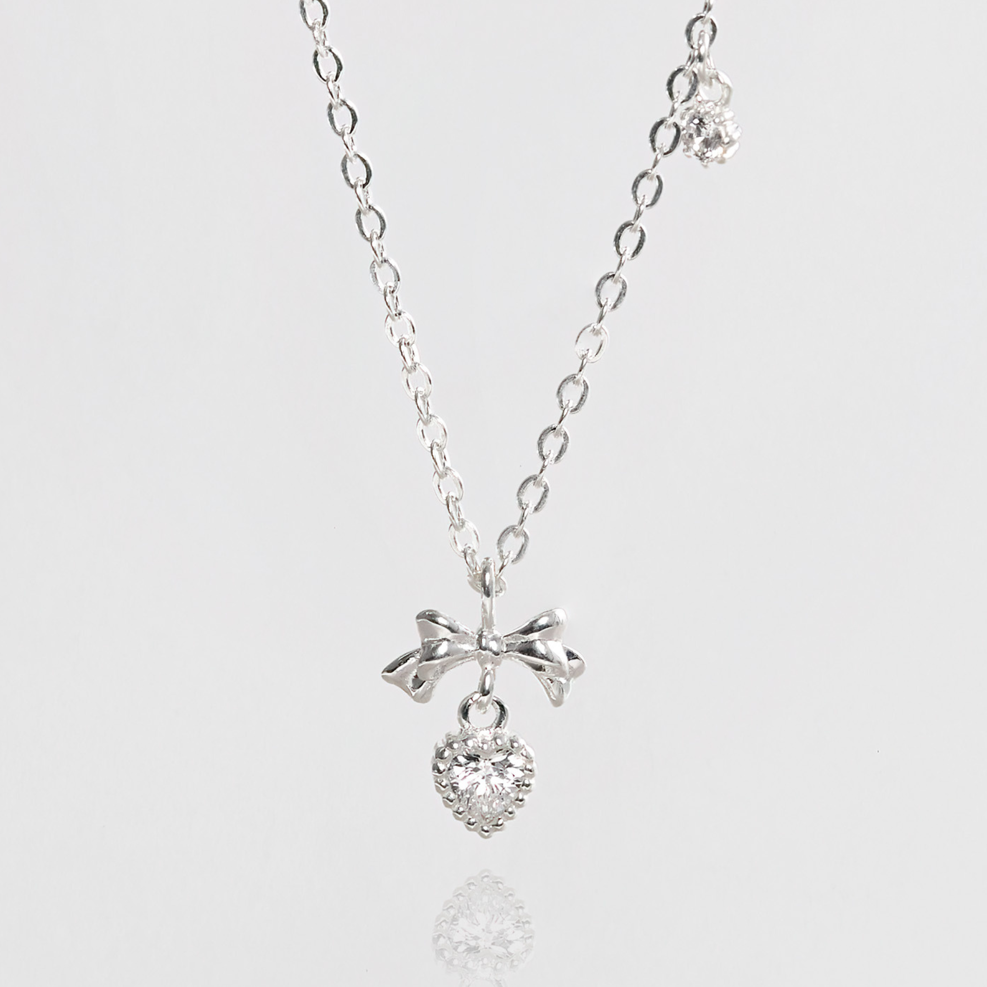 Quà Tặng 8/3 Dây Chuyền Bạc 925 Hình Nơ Treo Trái Tim Đính Đá CARA LUNA - Heart Bow Tie - VGN20