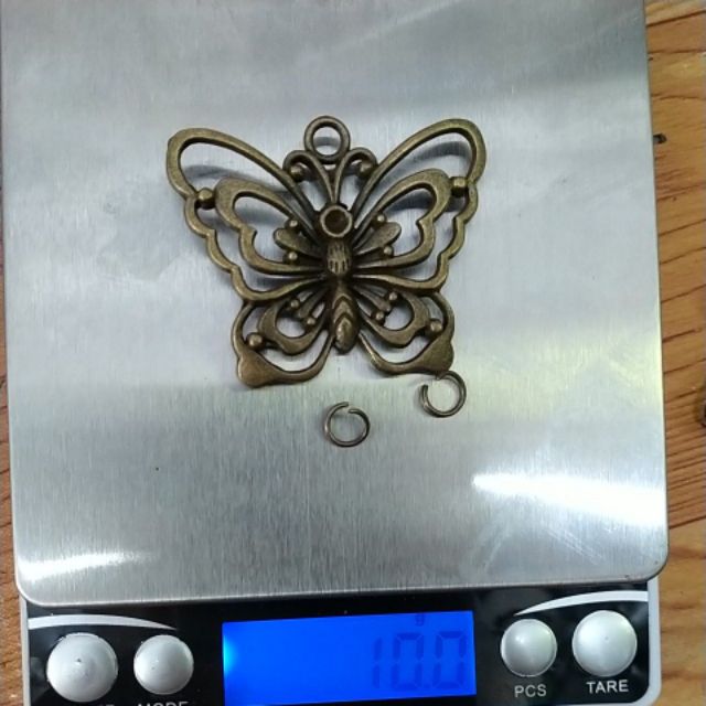 10/48gam mặt bướm 40x50mm màu đồng