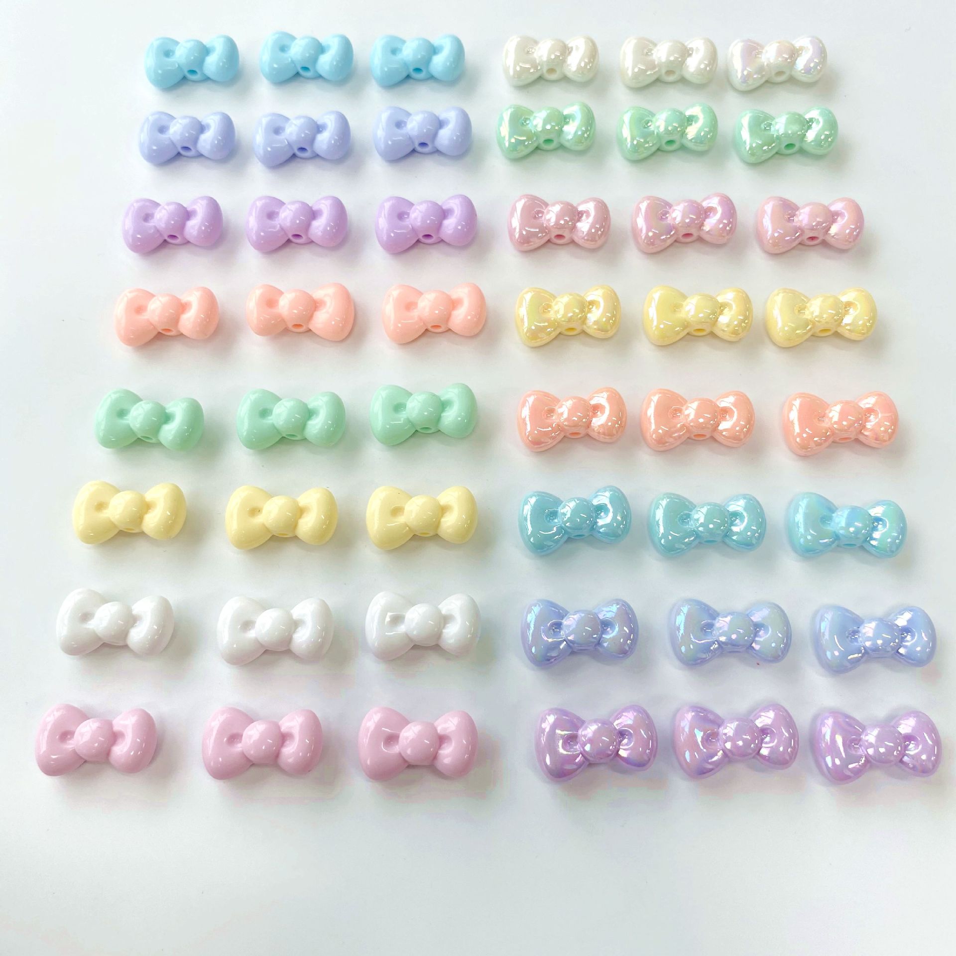 50-500gam Nơ 16x27mm dễ thương ,hạt charm holo  bóng đẹp có lỗ xỏ dọc
