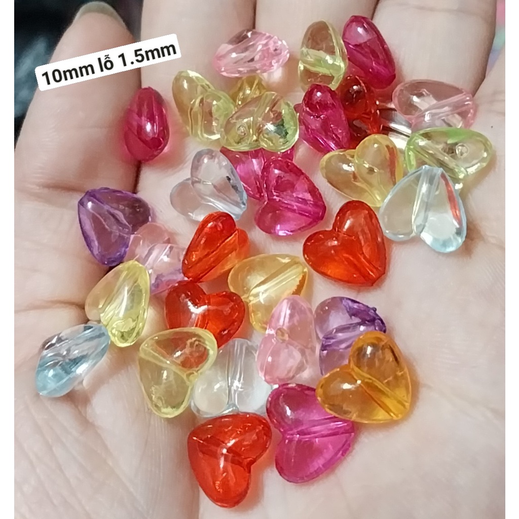 50-100gam Hạt trái tim, mặt cười các kiểu loai có lỗ xỏ dây dùng làm vòng hạt,cột tóc, đồ chơi, làm thủ công... (p225)
