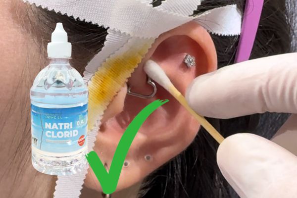 Lỗ xỏ khuyên bôi thuốc tím được không?
