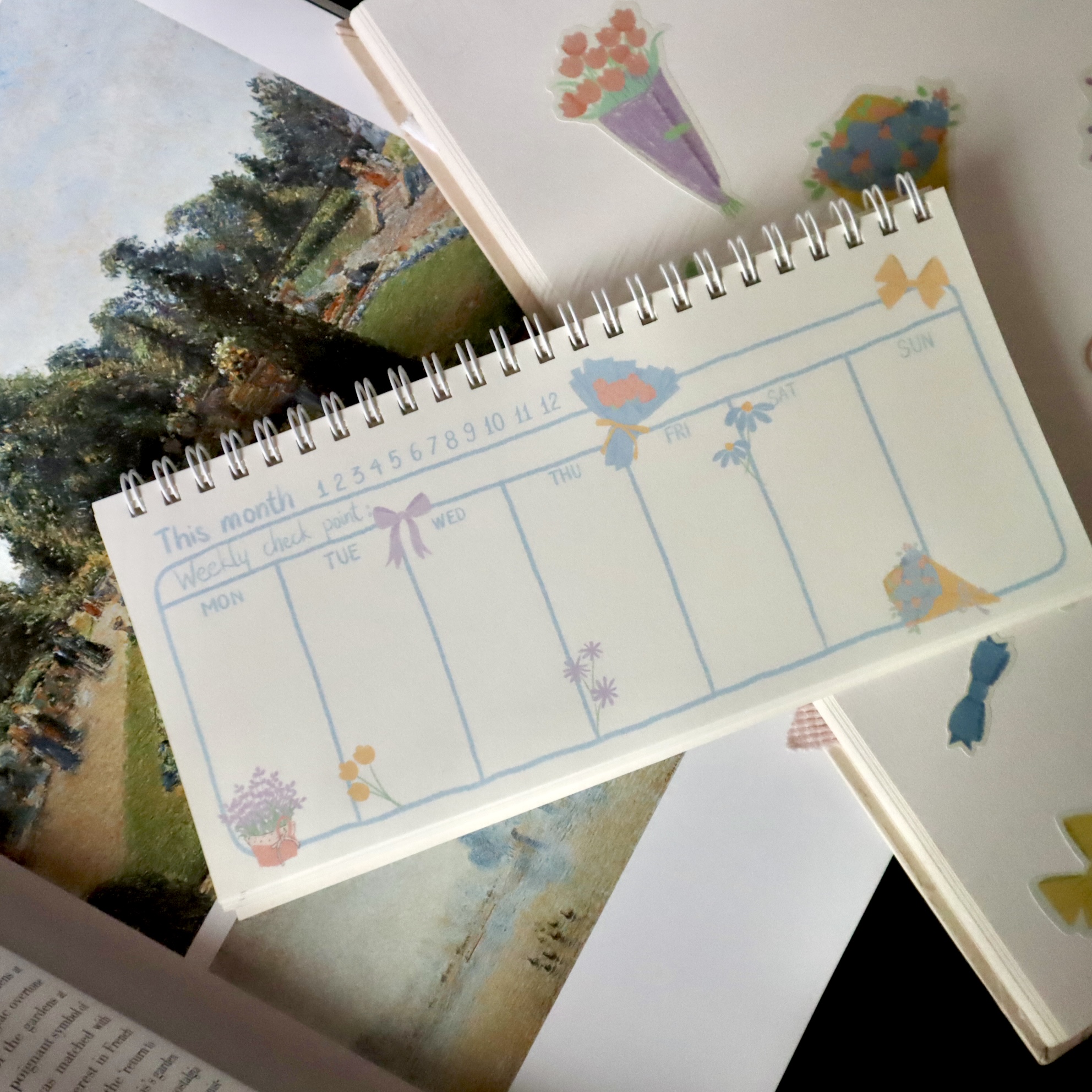 Sổ lò xo ngang weekly planner 21 cm x 10 cm Mai Lê