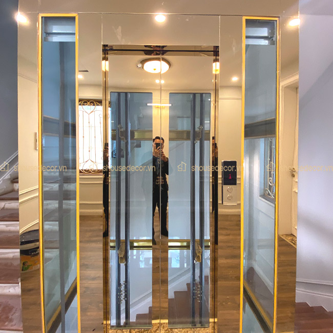 Ốp inox cho thang máy kính
