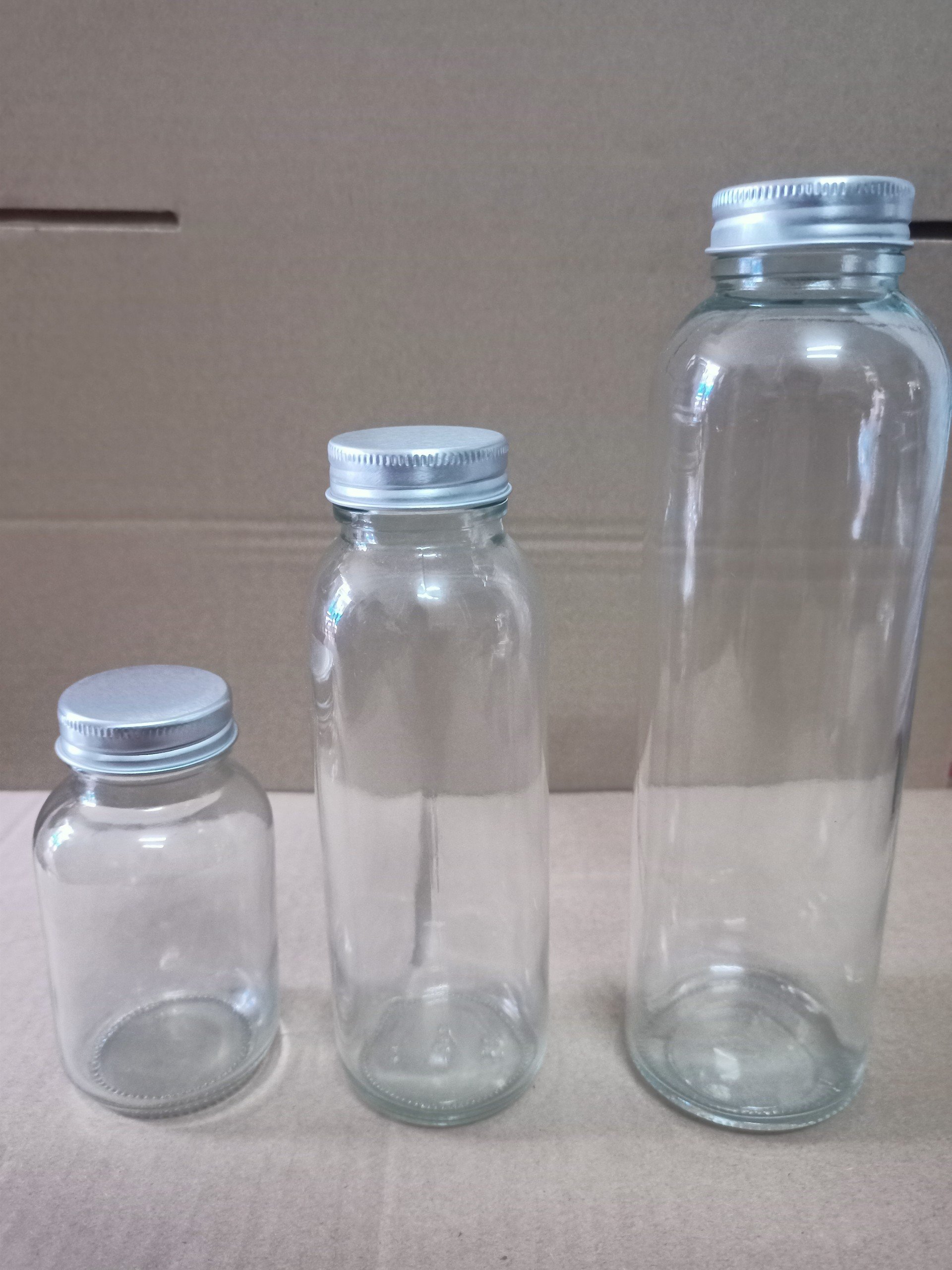 Chai Thủy Tinh 150ml 300ml 500ml Nắp Nhôm, Nắp Inox Có Dây Xách, Đựng Nước Ép, Sinh Tố, Detox, Nắp Nhựa Bọc Kim Loại Chắc Chắn - North Star Packing