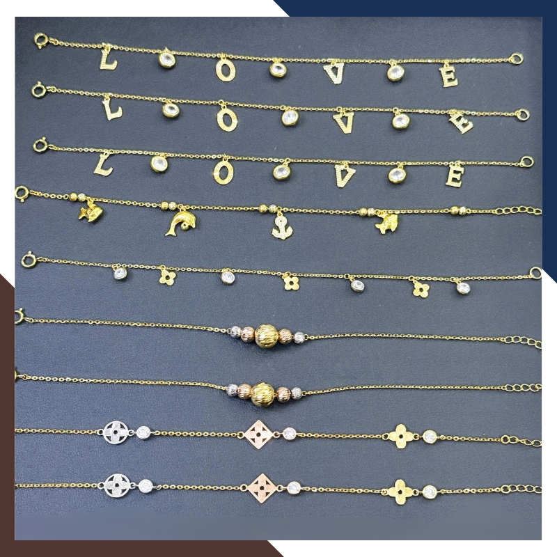 Lắc Tay Vàng Nữ 10K LTVN358 – Mix Charm Cá Heo, Cỏ 4 Lá & Bi Vàng 3 Màu Thanh Lịch