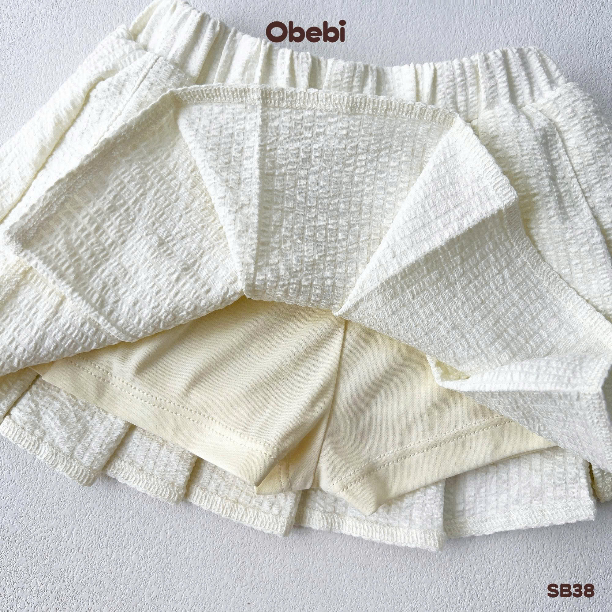 OBEBI - Bộ sơ mi cộc tay chân váy xếp ly OBEBI (73-120)