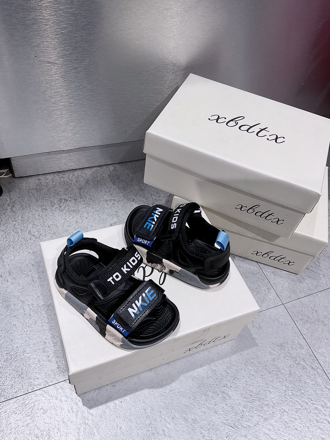 KB - Sandal NIKE đen loang xanh(21-25)