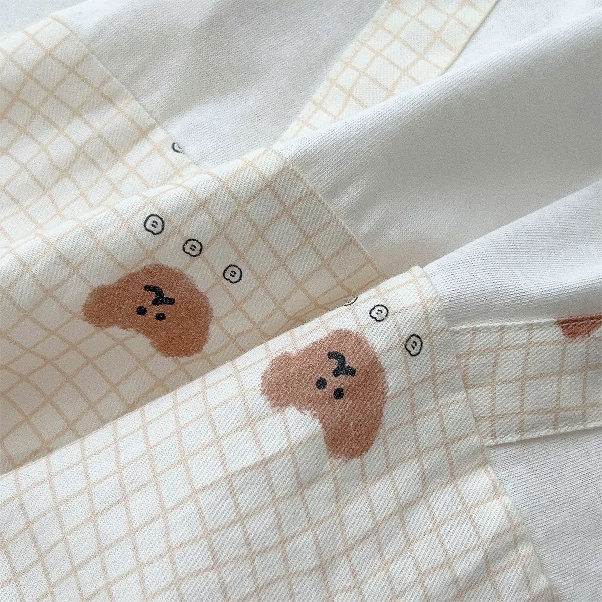 JS - Body cotton trắng viền nâu giả yếm đính gấu(66-80)