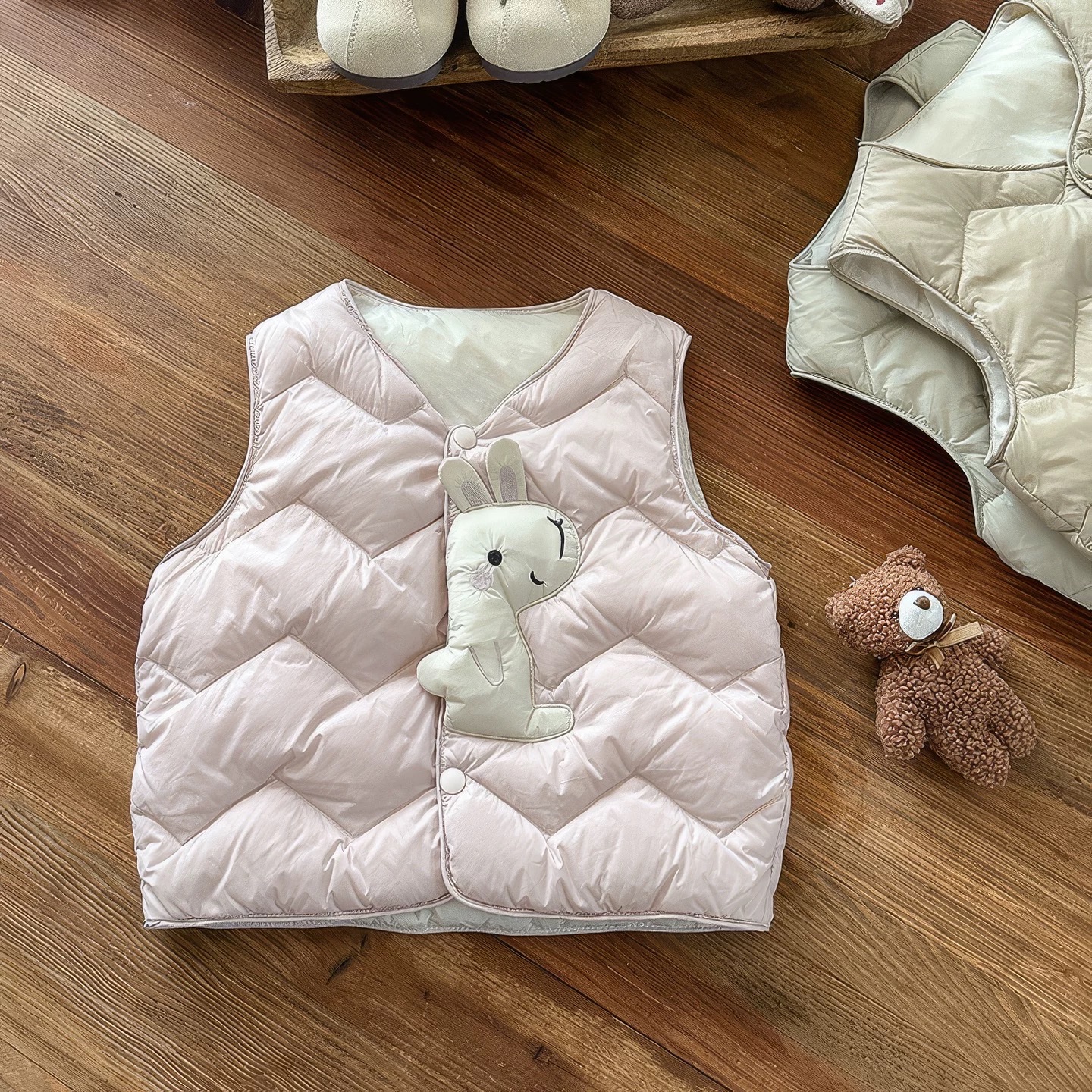 BK - Áo gile phao in hình mặt trước (73-110)