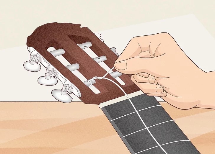 CÁCH THAY DÂY ĐÀN GUITAR CLASSIC 13 e jpeg